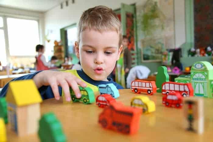 kid playing with toys