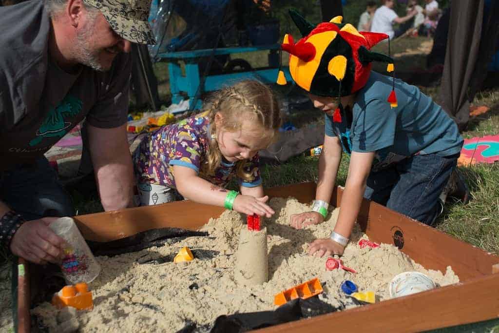 Children playing in a sandpit at Nozstock festival