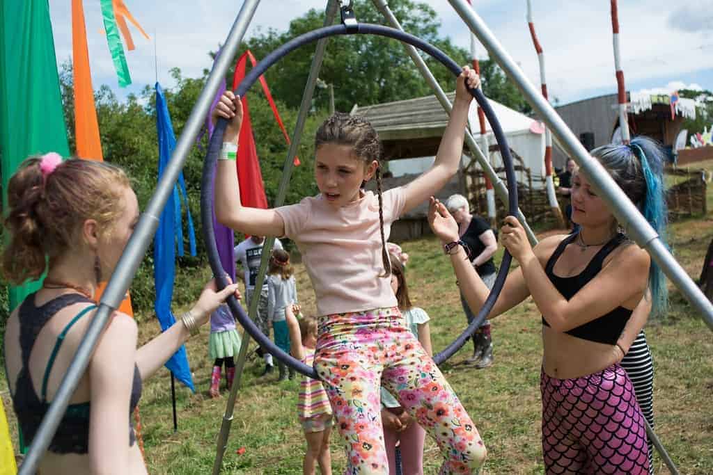 Young girl swinging in a hoop