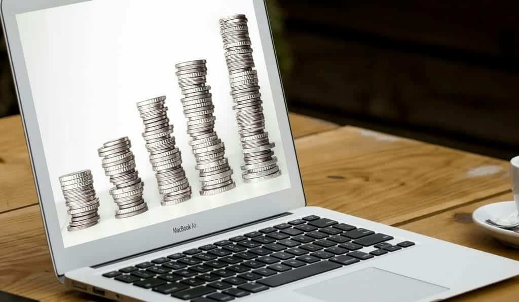 Macbook Air with coin stacks