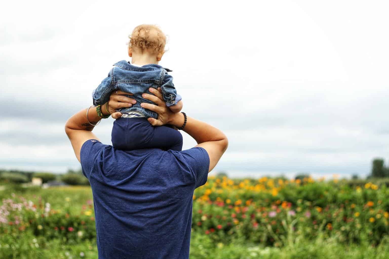 Baby on man's shoulders