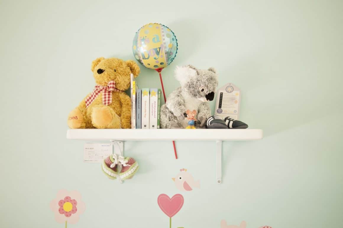 Toys on a nursery shelf