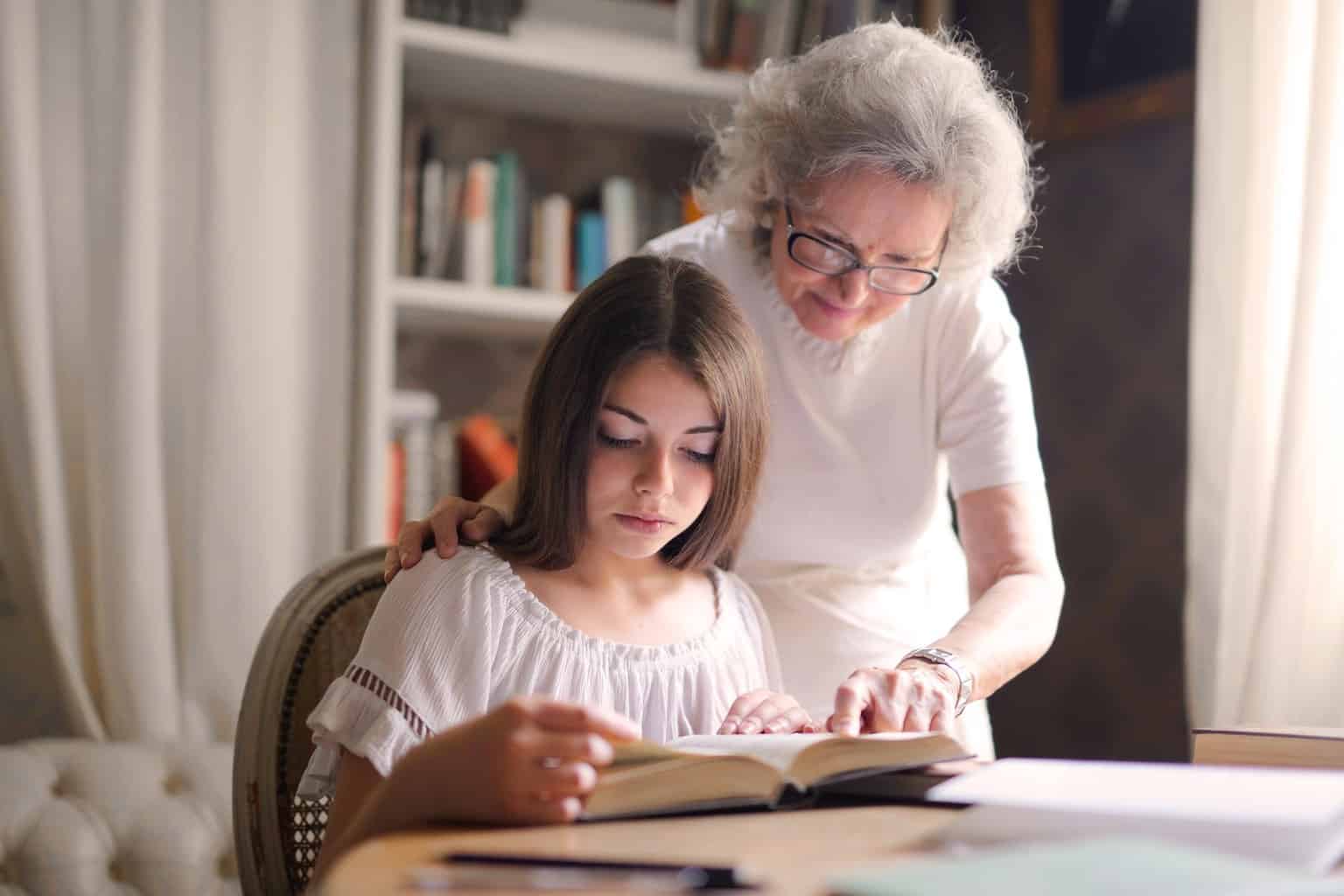 photo of women reading a book