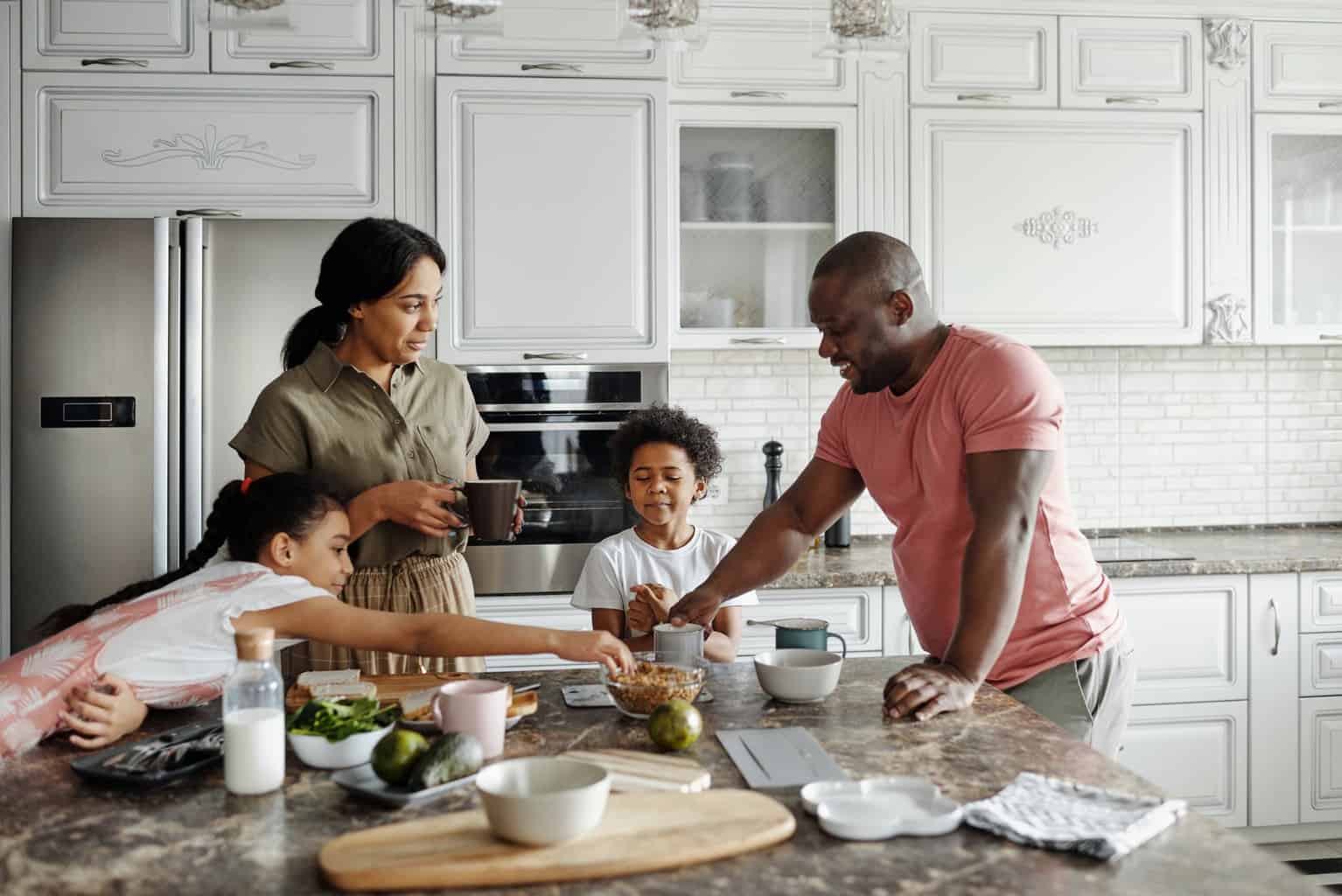 family making breakfast in the kitchen