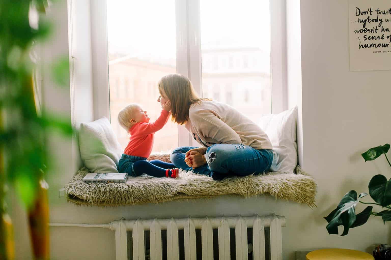 baby touching woman s face