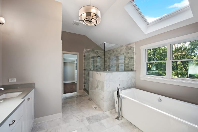 Modern bathroom with a skylight above the bath.