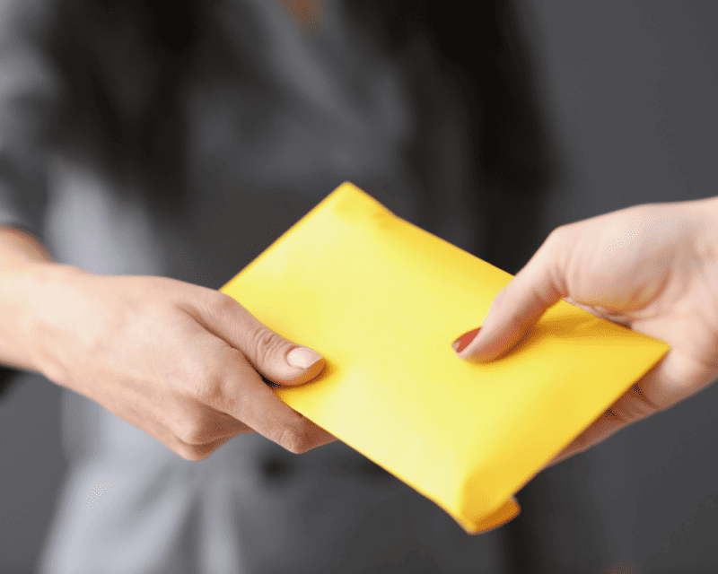 salary advance in a yellow envelope