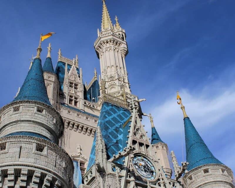 a castle with blue and gold spires