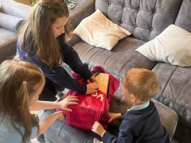 a group of kids unpacking a bag