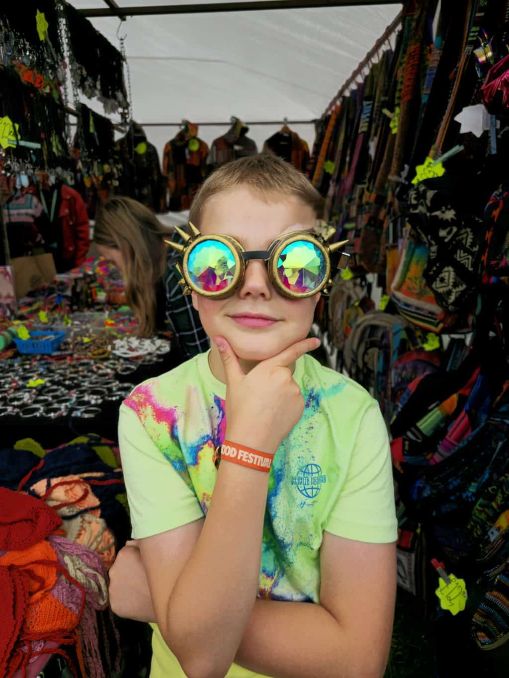 a boy wearing glasses with spikes on them
