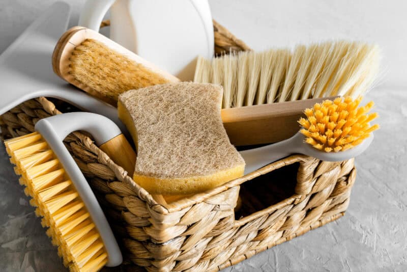 a basket full of cleaning brushes