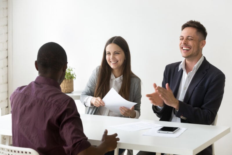 a group of people sitting at a table