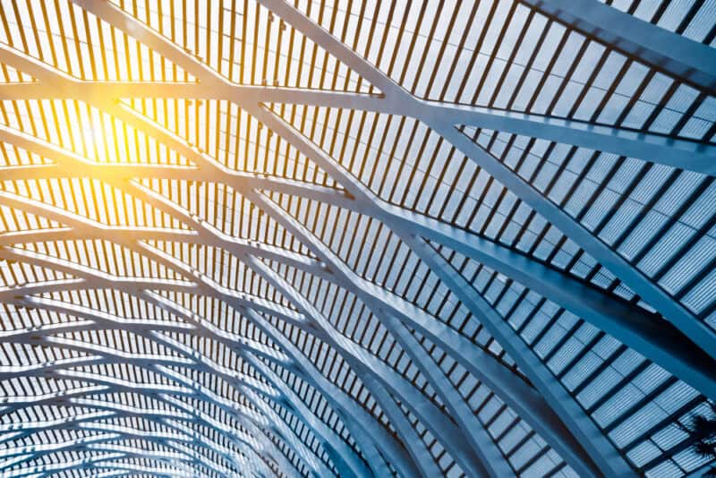 a metal building roof with sun shining through